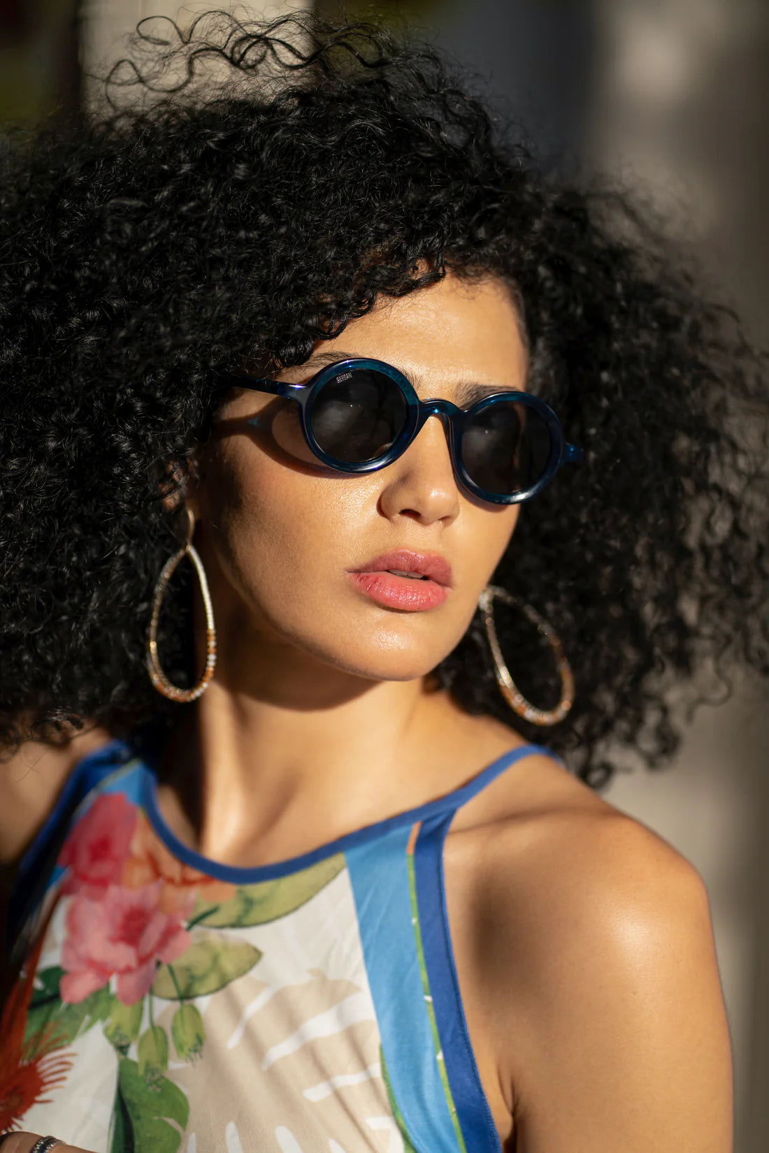 Sefsan Sphaira sunglasses with transparent blue frame and smoke lenses, unisex modern design, lightweight and stylish for everyday wear model front view 