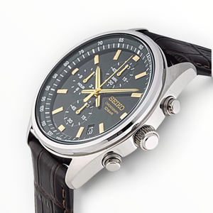 SUL EXTRAS Seiko chronograph watch with green dial, gold hands, and brown embossed leather strap on stainless steel
