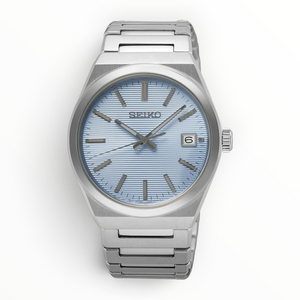 SUL EXTRAS Seiko Classic men's watch with a light blue textured dial, silver stainless steel case, and bracelet.