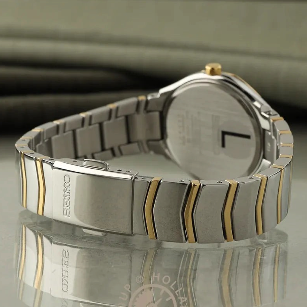 SUL EXTRAS Seiko Classic ladies' watch featuring a two-tone silver and gold stainless steel bracelet and folding clasp.