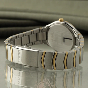 SUL EXTRAS Seiko Classic ladies' watch featuring a two-tone silver and gold stainless steel bracelet and folding clasp.