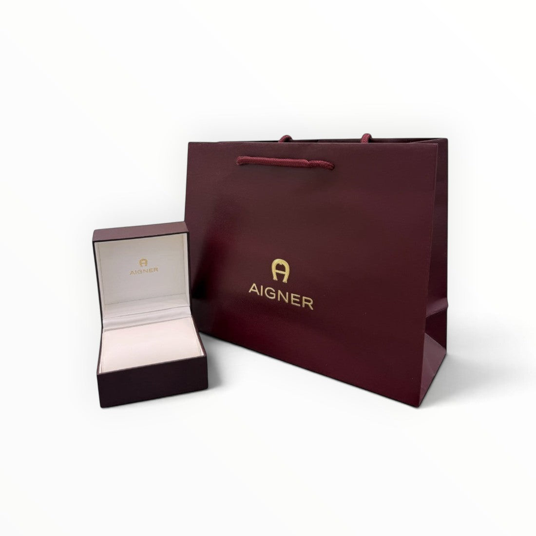SUL EXTRAS Aigner burgundy lacquer gift box and matching shopping bag with gold logo branding