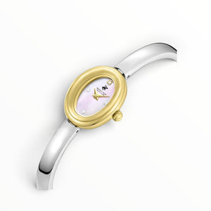 SUL EXTRAS Beverly Hills Polo Club women's watch with oval gold case, pink mother-of-pearl dial, and silver bangle.