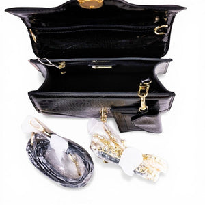 SUL EXTRAS Midnight Set featuring a black crocodile-embossed top-handle bag with gold hardware and detachable straps.