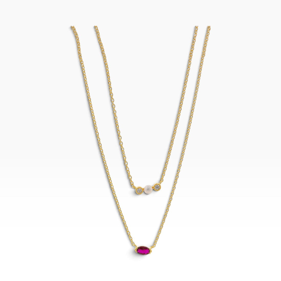 SUL EXTRAS gold-plated layered necklace featuring a white pearl, small zirconia stones, and a red zirconia centerpiece.