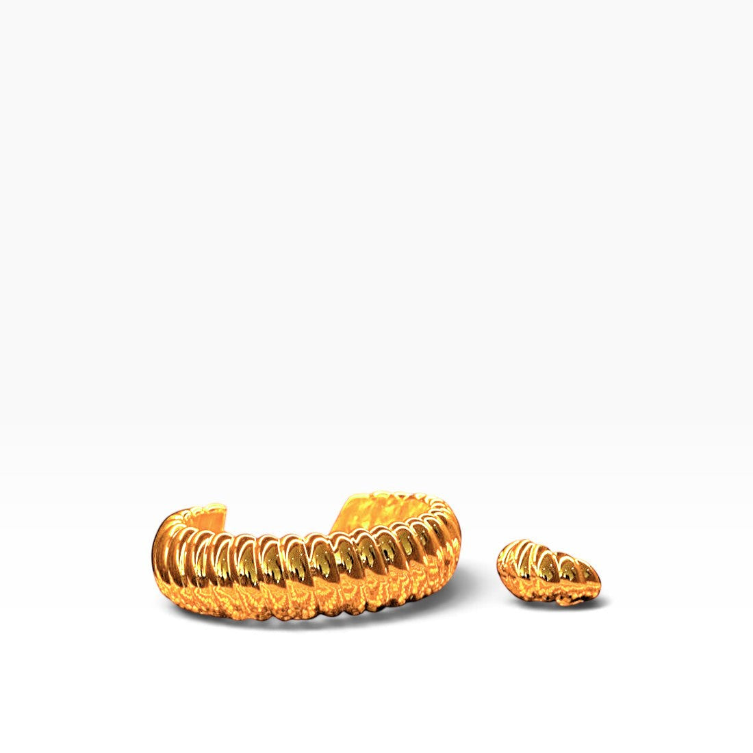 SUL EXTRAS Grace Set featuring gold ribbed hoop earrings and a matching sculptural ring with architectural curves.