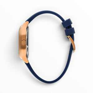 SUL EXTRAS Lee Cooper London men's watch with a rose gold cushion-square case and navy blue silicone strap, side view.