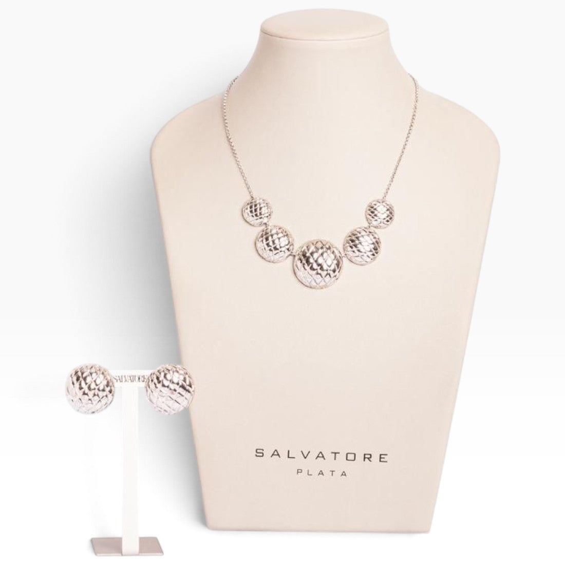 SUL EXTRAS Madras Rhodum jewelry set featuring a rhodium-plated stainless steel necklace and matching stud earrings.