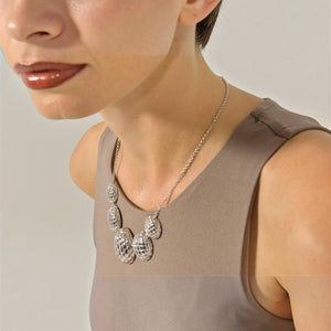 SUL EXTRAS Madras Rhodum necklace featuring textured silver-plated stainless steel oval charms on a delicate chain