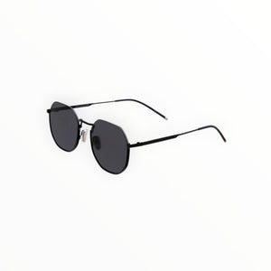 SUL EXTRAS Parade sunglasses featuring black geometric round frames and smoke-tinted UV protection lenses.