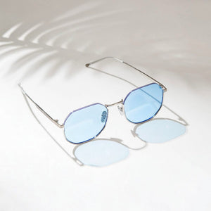 SUL EXTRAS Parade sunglasses featuring oversized geometric round blue lenses and a lightweight silver metal frame.
