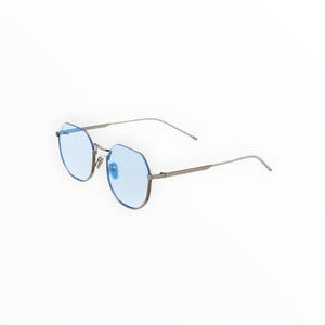 SUL EXTRAS Parade sunglasses featuring oversized geometric round frames in silver metal with light blue tinted lenses.