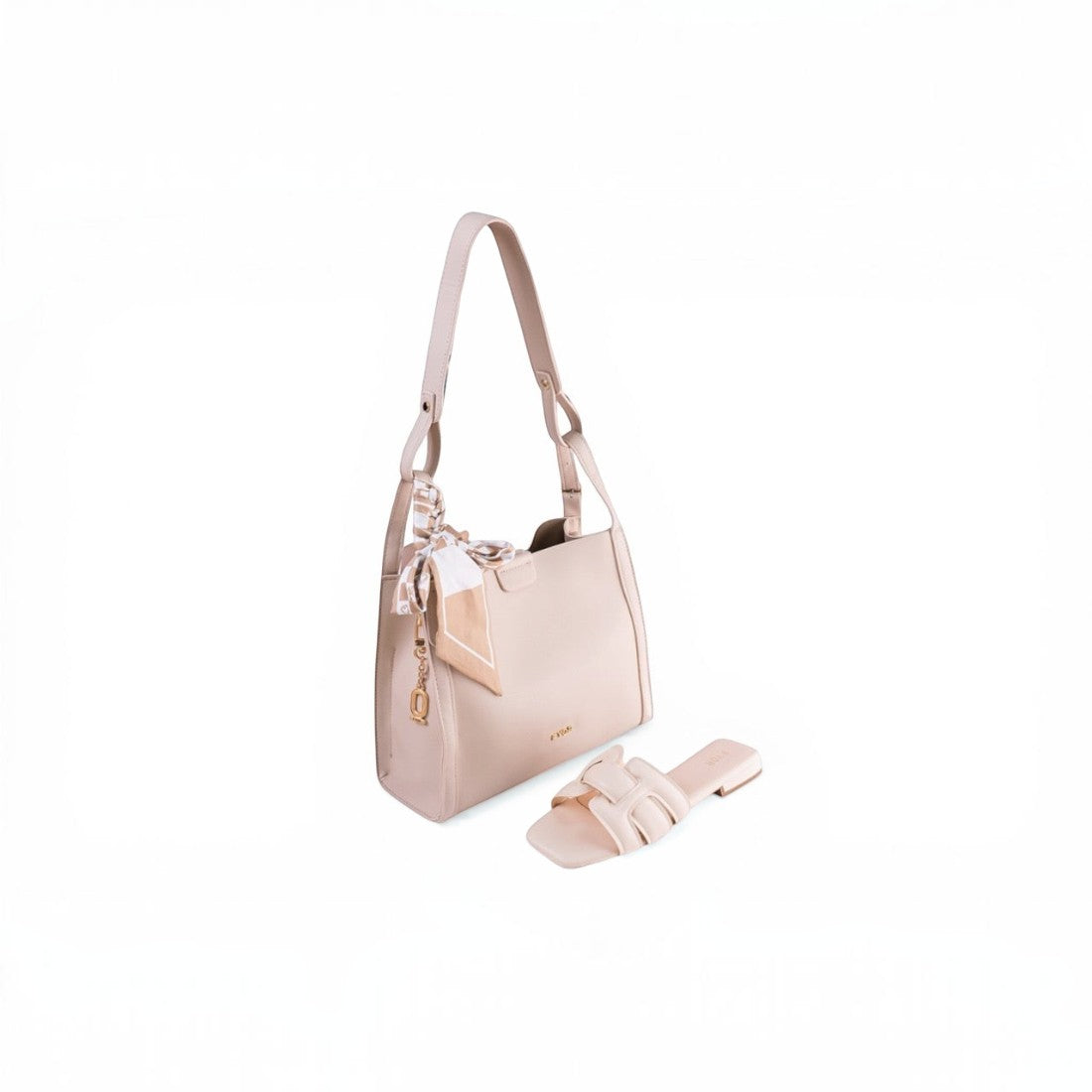SUL EXTRAS Sahara Silk Set featuring an off-white shoulder bag with a patterned scarf and matching nude flat slides.