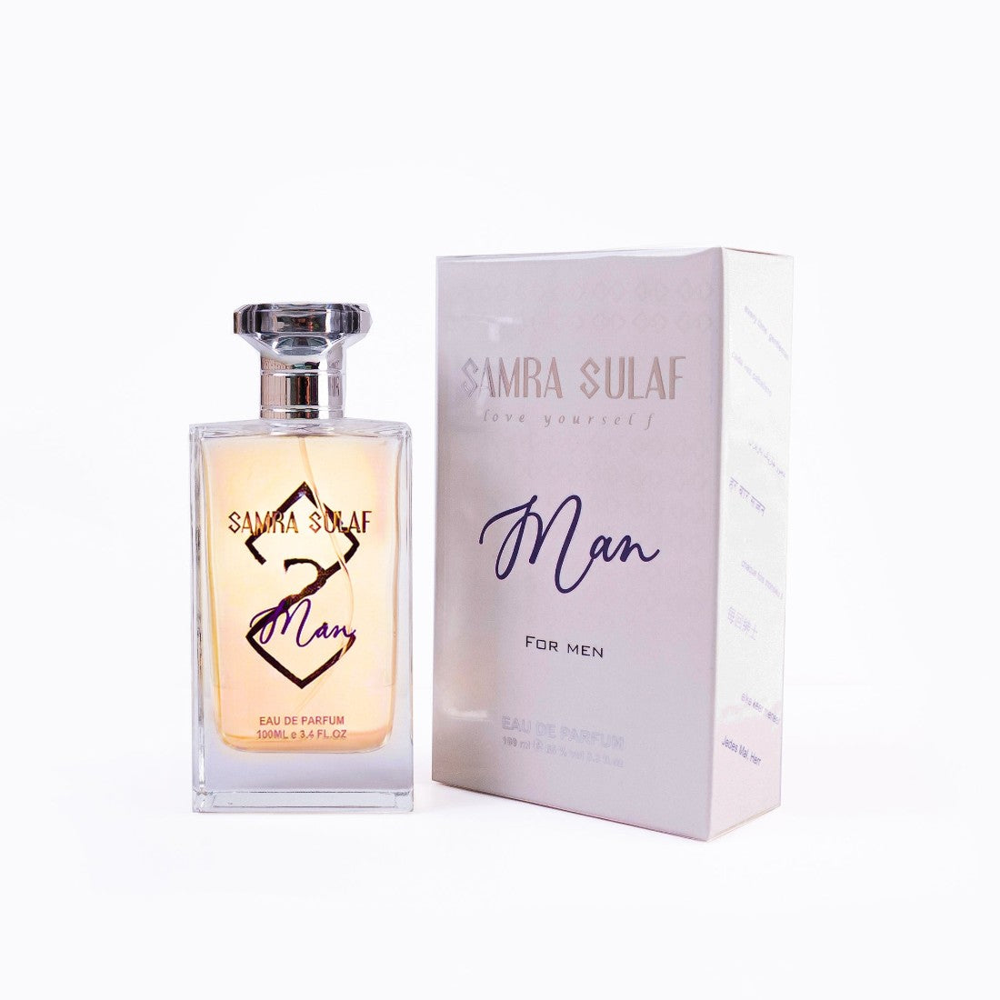 SUL EXTRAS Samra Sulaf Man eau de parfum 100ml glass bottle with silver cap next to its branded white gift box