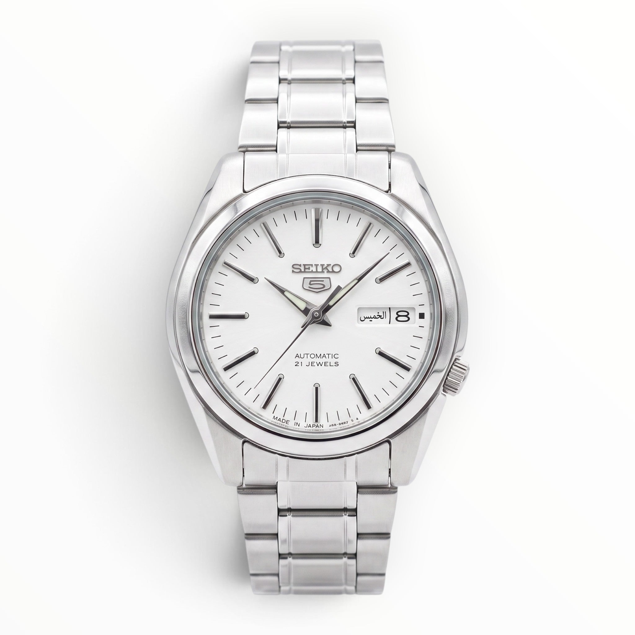 SUL EXTRAS Seiko 5 SNKL41J1 automatic watch with a sunburst silver dial, stainless steel case, and bracelet.
