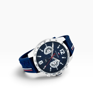 SUL EXTRAS Tommy Hilfiger men's multifunction watch with navy blue silicone strap, silver case, and tachymeter bezel.