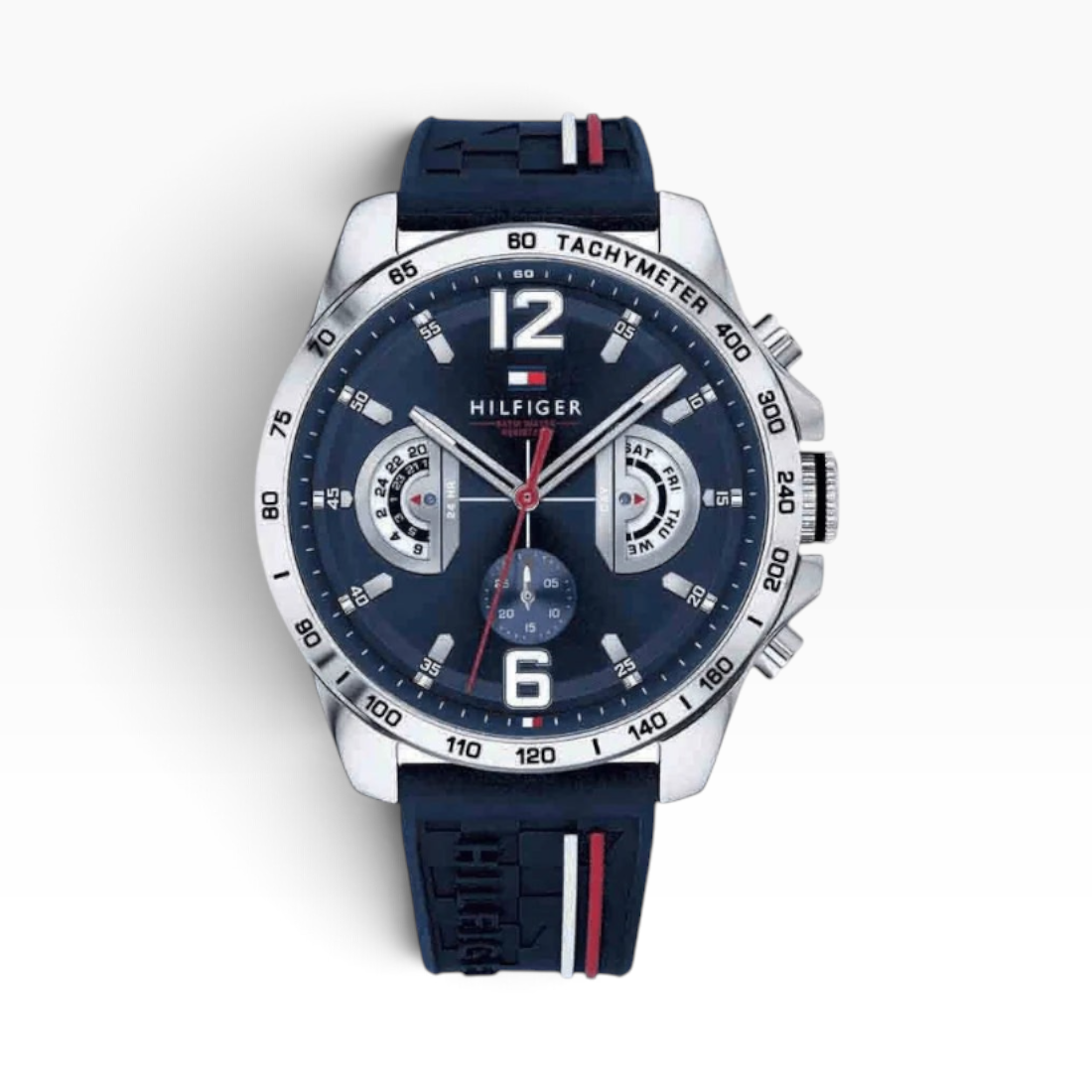 SUL EXTRAS Tommy Hilfiger men's multifunction watch with navy blue silicone strap, tachymeter bezel, and silver case.