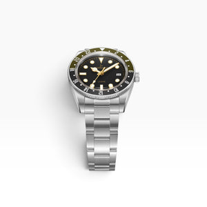 SUL EXTRAS Tornado Lumina Date watch with matte black dial, olive and black GMT bezel, and brushed stainless steel band.