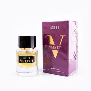 SUL EXTRAS Velvet perfume bottle and purple box with gold lettering on a white background
