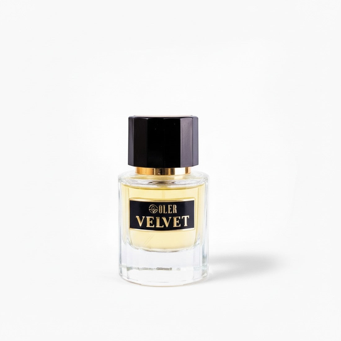 SUL EXTRAS Velvet perfume bottle with a clear glass body, gold accents, and a black cap against a white background.