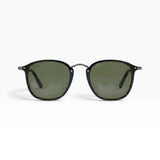 SUL EXTRAS Visi sunglasses featuring a shiny black rectangle frame and green lenses with metal stud detailing.