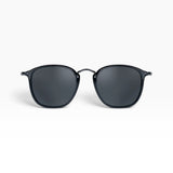 SUL EXTRAS Visi sunglasses featuring a shiny black rectangle frame with green lenses and metal stud accents.